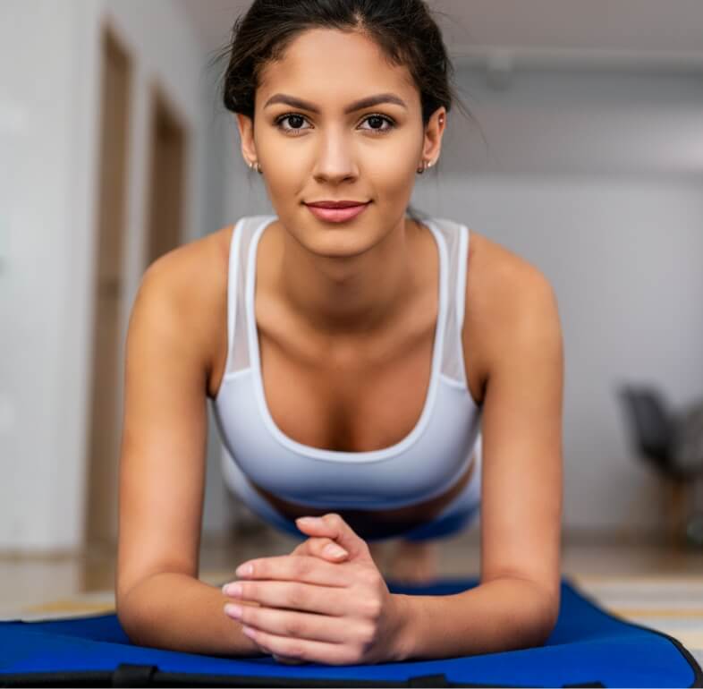 happy-fit-young-woman-exercising-at-home-healthy-2023-11-27-05-04-55-utc (1)
